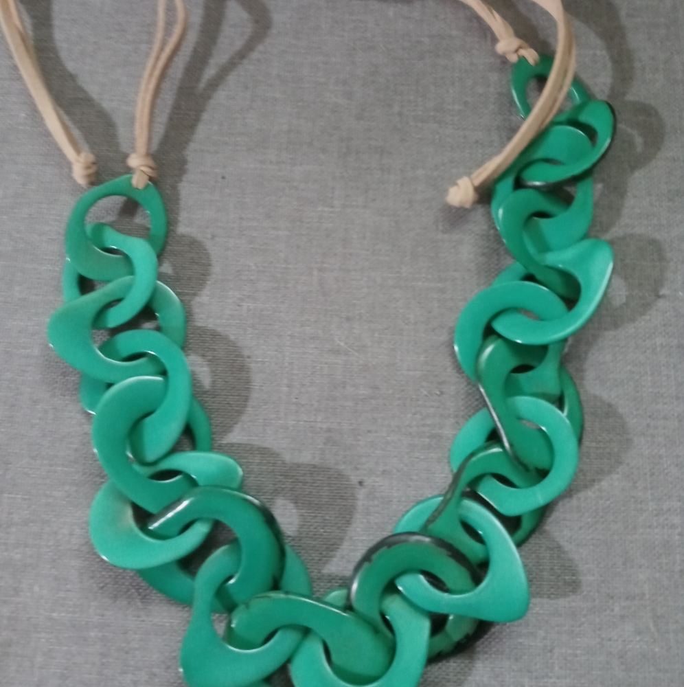 Unique green shapes intermixed into a necklace